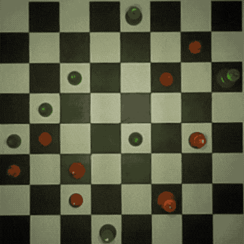 Animation of colored circles representing what the Raspberry Turk sees, fading to the actual chessboard captured by the camera.